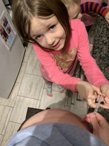 daughter-helping-with-needle